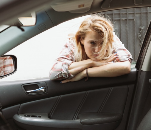 A woman at a car window