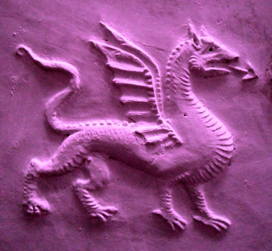 A purple dragon carved in plaster
